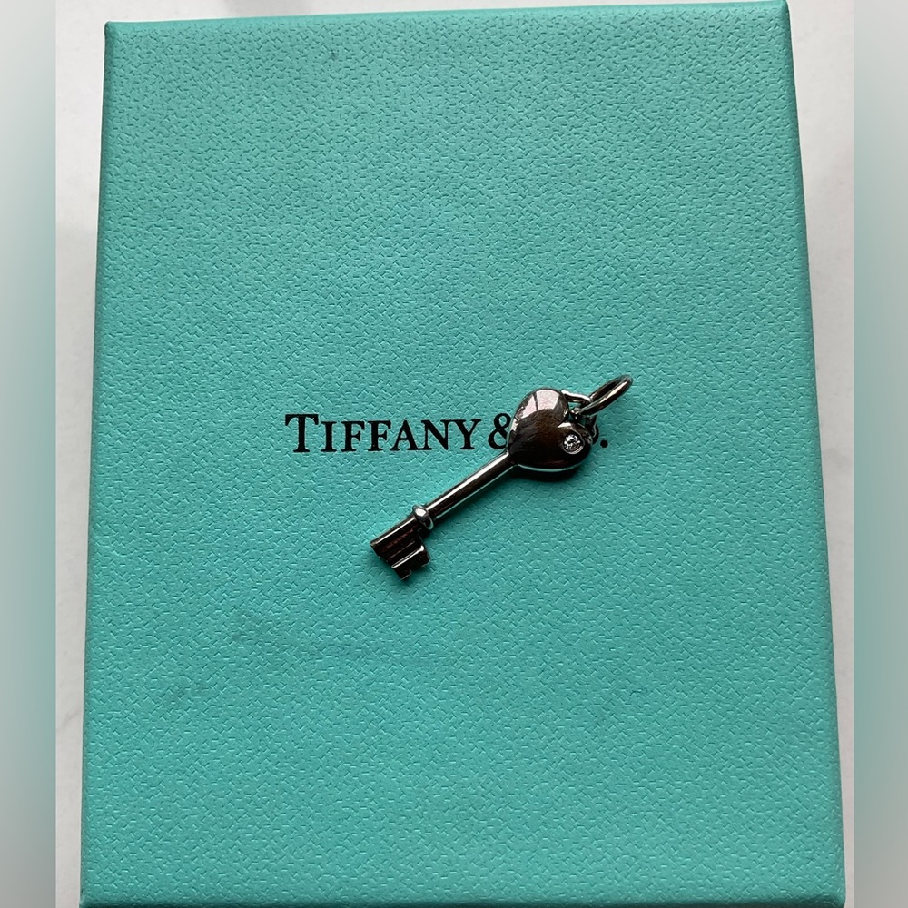Authentic Tiffany & Co. Key charm with diamond.